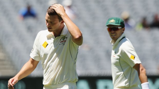 Josh Hazlewood of Australia reacts after he bowled a no ball when dismissing Darren Bravo of the West Indies during day four of the Second Test match between Australia and the West Indies at MCG.