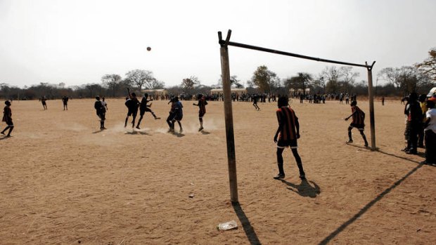 Playing for peace … a friendly football match in a remote part of western Zimbabwe.