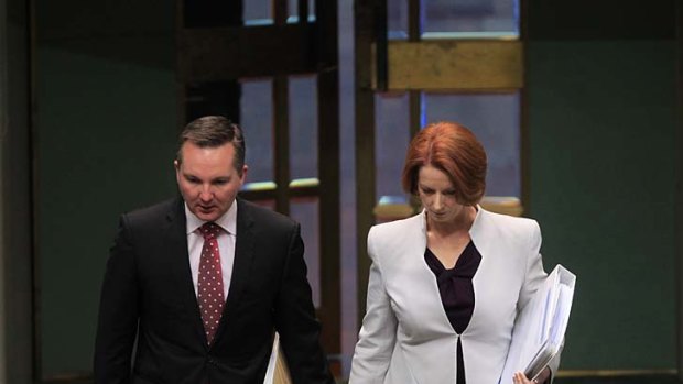 Prime Minister Julia Gillard and Immigration Minister Chris Bowen arrive for question time.