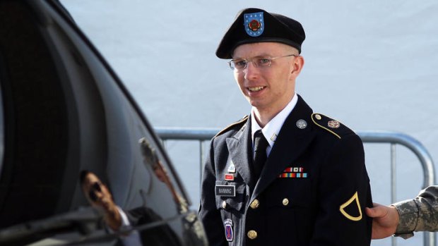 US Army Private Bradley Manning is escorted as he leaves a military court in Fort Meade, Maryland.