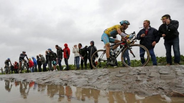 Treacherous conditions ... over leaderand  Astana team rider Vincenzo Nibali of Italy cycles on a cobble-stoned section during the 152 km fifth stage.