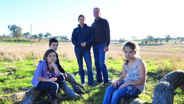 Deadly dust ... David Mansfield and Jessica McNair fear for the health of their children Liam, 10, and twins Charlotte (left) and Heather, 8.