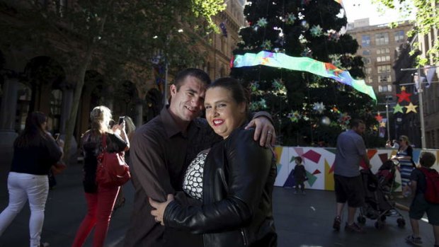 'Tis the season: Merinda Rousso and Joshua Renfrey by the Christmas tree in Martin Place that Ms Rousso used for her marriage proposal.