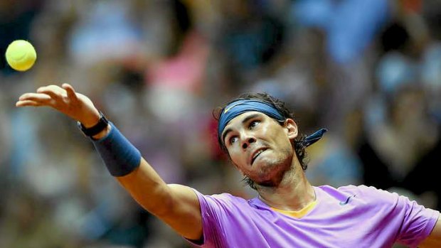 Comeback success ... Rafael Nadal serves to Argentina's David Nalbandian.
