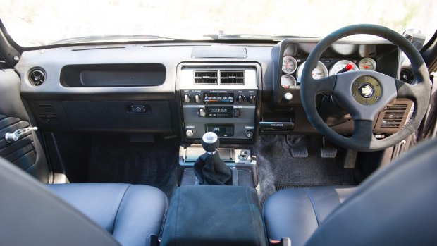 The updated interior, dash, transmission and an original '80s era radio with bluetooth hidden behind it.