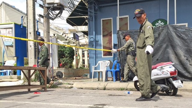 Investigators work at the scene of an explosion in the resort town of Hua Hin on Friday.