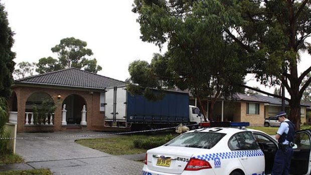 Man shot ... police cordon off the house in Doonside.
