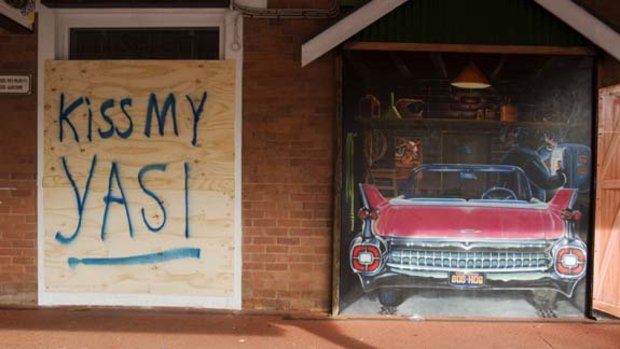A defiant message on the boarded-up Hog's Breath Cafe in Cairns.