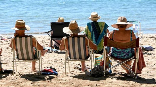 Retirees, not worrying about their investment portfolio, on a beach near Bowen, Australia.