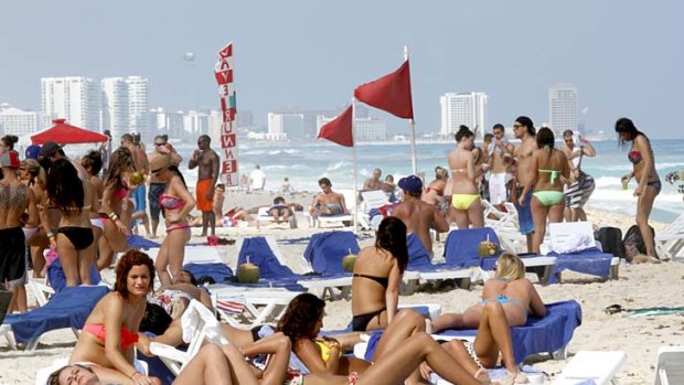 Despite drug violence in Mexico, Cancun has remained relatively unscathed. And millions of Americans still come, especially during spring break, when the town becomes a weeks-long party.