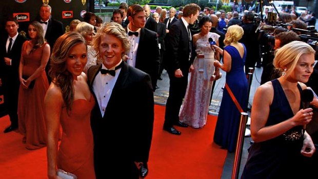 Adelaide's Rory Sloane with partner Belinda Riverso on the red carpet.