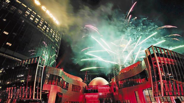 Fireworks mark the opening of Melco Crown Entertainment's City of Dreams casino in Macau.