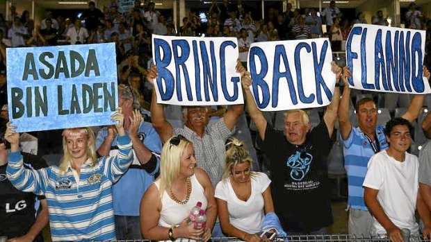Signs of the times: Sharks supporters make their feelings felt about the ASADA investigation that targeted the club on the eve of the season.
