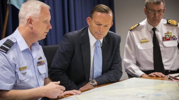Top brass: Tony Abbott receives a briefing at Defence headquarters. 