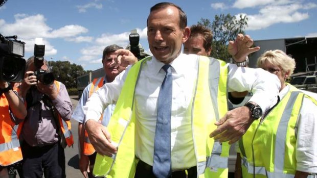 Opposition Leader Tony Abbott in Rockhampton campaigning has defended Liberal candidate Ray King over comments about the burqa.
