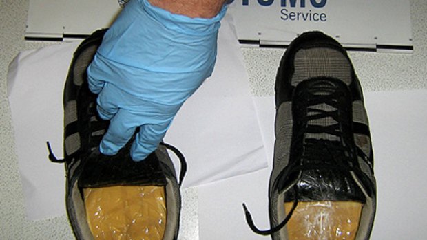 A Customs detector dog detected heroin in a passenger's sneakers.