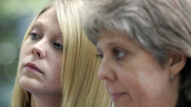 Kristie Reed, left, still bears the scars of a brutal attack by Paul Warren Powell, as her mother, Lorraine Whoberry, right, looks on.
