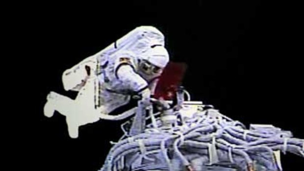 A video grab taken at the Beijing Space Command and Control Center shows Zhai Zhigang outside the orbit module of the Shenzhou-7 spacecraft during his spacewalk.