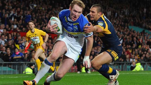 Former Canberra Raider, Joel Monaghan, scores the opening try for Warrington.