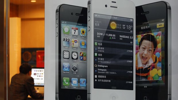 An iPhone poster on display at a phone shop in Beijing, China.