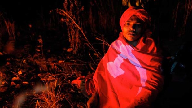 The real <i>Avatar</i> tribe ... wrapped in a communist flag, a Dongria Kondh man attends a protest in the Niyamgiri Hills in February.