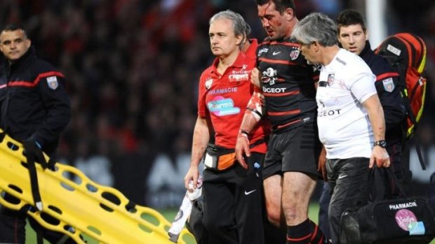 Battered: Florian Fritz leaves the field during the quarter-final match between Toulouse and Racing Metro.