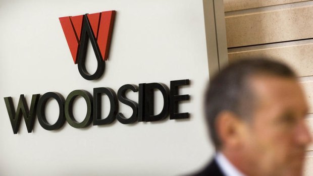 Woodside profit is being held back by the costs of its new Pluto LNG field.