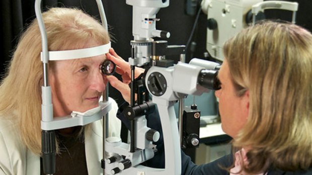 "Amazing": Dr Allen (right)  examines Dianne Ashworth's bionic implant.