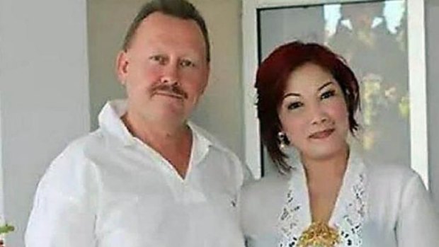 KILLED IN BALI: Robert Kelvin Ellis, pictured with his wife Julaikah Noor Aini, was found with his throat slashed. 