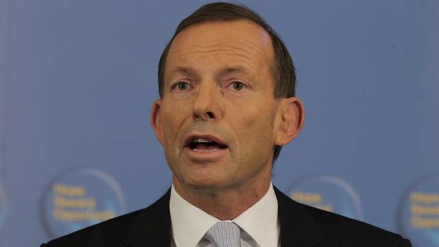 Opposition Leader Tony Abbott responds to the announcement by Prime Minister Julia Gillard of a September 14 election at Parliament House in Canberra.