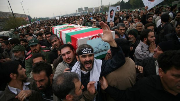 Iranians carry the coffin of a soldier killed at Alghadir. <i>Photo: AP</i>