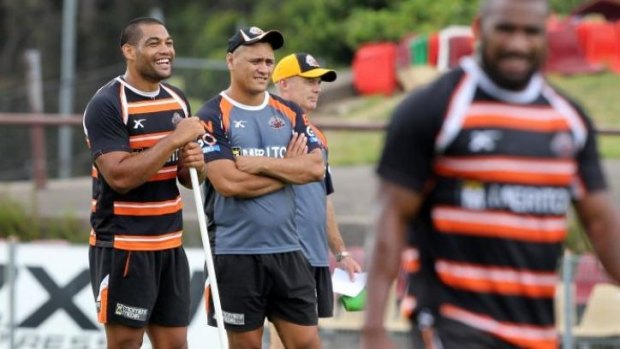 Wests Tigers assistant coach David Kidwell oversees a training session alongside second-rower Adam Blair.