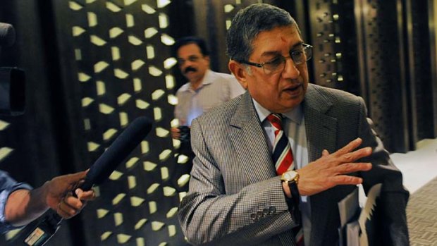International Cricket Council chairman N. Srinivasan of India gestures after attending a board meeting in Singapore on Saturday. Srinivasan's son-in-law has been found guilty of illegal betting on games in the IPL.