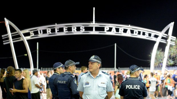 Police patrol the main entrance to the beach during Schoolies.