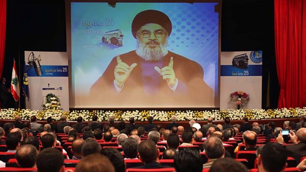 Inflamed rhetoric: Hezbollah's Hassan Nasrallah warns in a televised speech that Syria will continue to arm the militant group.