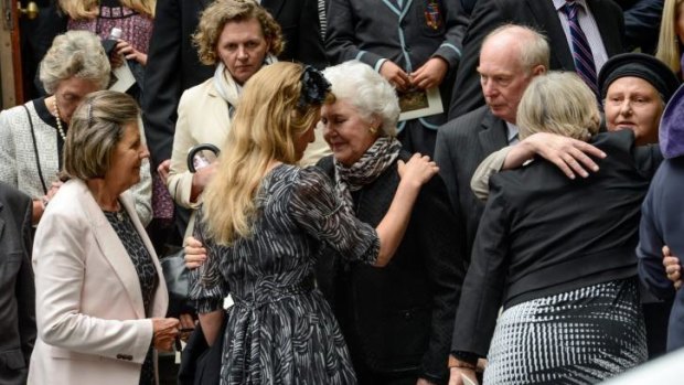 Hester Fraser comforts her grandmother, Tamie Fraser, at the funeral for former prime minister Malcolm Fraser at Scots Church in Melbourne in March.