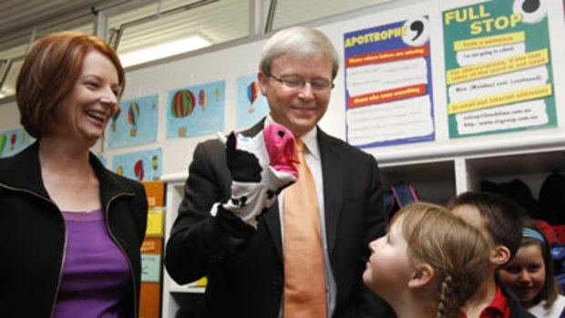 Julia Gillard and Kevin Rudd visit the Amaroo School in Canberra yesterday.