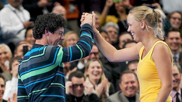 Perfect match: Golfer Rory McIlroy with fiancee, tennis player Caroline Wozniacki.