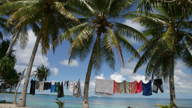 Laundry hangs on the edge of a lagoon, near Funafuti, Tuvalu. Pacific Island nations called for the Paris climate agreement to be legally binding. 