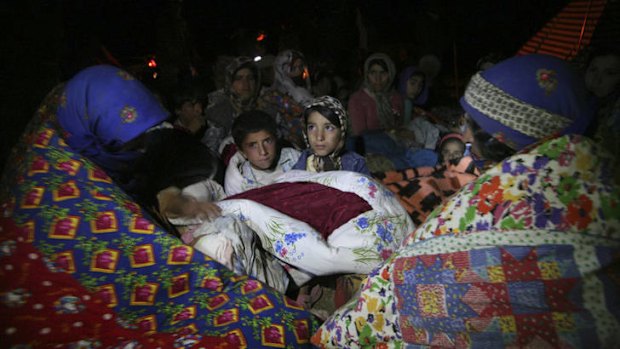 Residents spend the night outside their homes after an earthquake struck the city of Varzaqan.