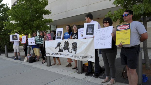 Activists from Animal Liberation ACT and the Coalition of Animal Protectors protest outside court before the hearing. 