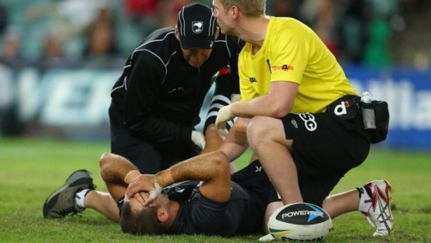 Injured: Jason Nightingale receives treatment during the Test against Australia.