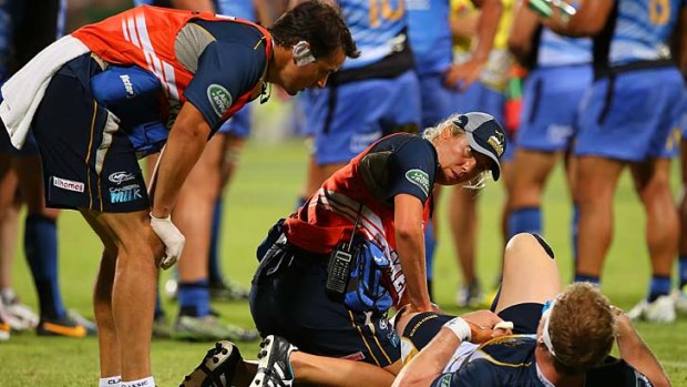 Knee injury: David Pocock of the Brumbies receives medical attention during round three of the Super Rugby match against the Western Force.