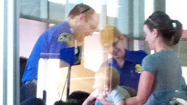 The photo taken of a baby being searched at Kansas Airport went viral after being posted on Twitter.