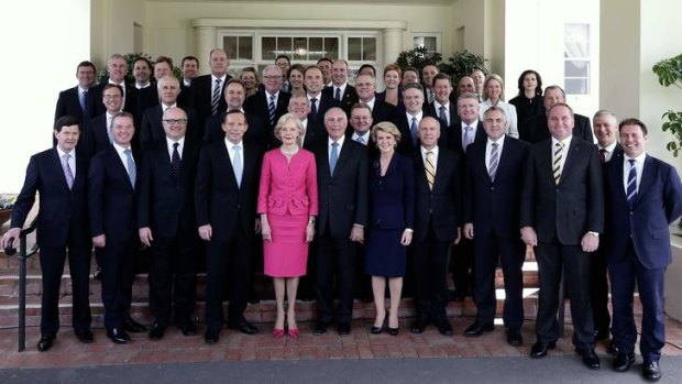 Governor-General Quentin Bryce poses for photos with Prime Minister Tony Abbott and his new ministry after the swearing-in ceremony at Government House.