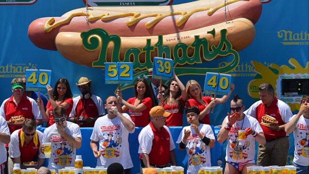 Conspicuous consumption ... Nathan's Famous Fourth of July International Hot Dog Eating Contest, Coney Island, and if nothing else, it takes plenty of guts.