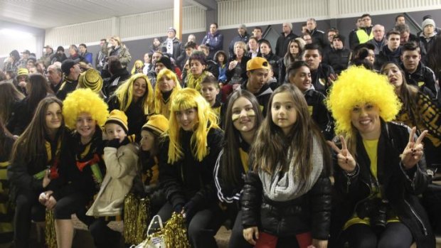 Faces in the crowd: South Springvale fans.