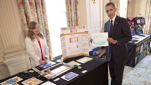 President Barack Obama with Sylvia Todd and one of her robot-drawn paintings at the White House Science Fair.