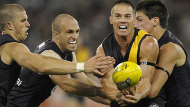 Surrounded... Ben Cousins, seen here with former teammate Chris Judd.