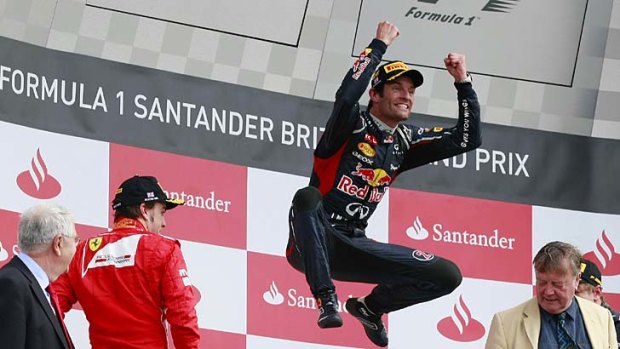 Jumping for joy ... Mark Webber celebrates after winning the British Grand Prix at Silverstone.